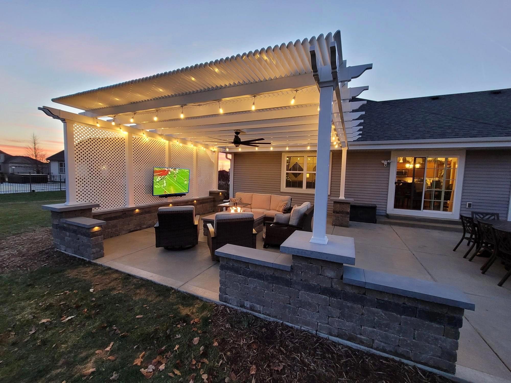 outdoor living room with freestanding pergola tv and ourdoor furniture