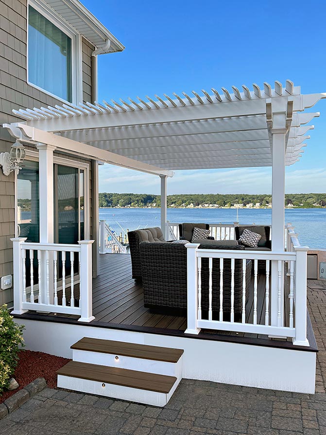 Freestanding White Pergola on a deck overlooking a lake