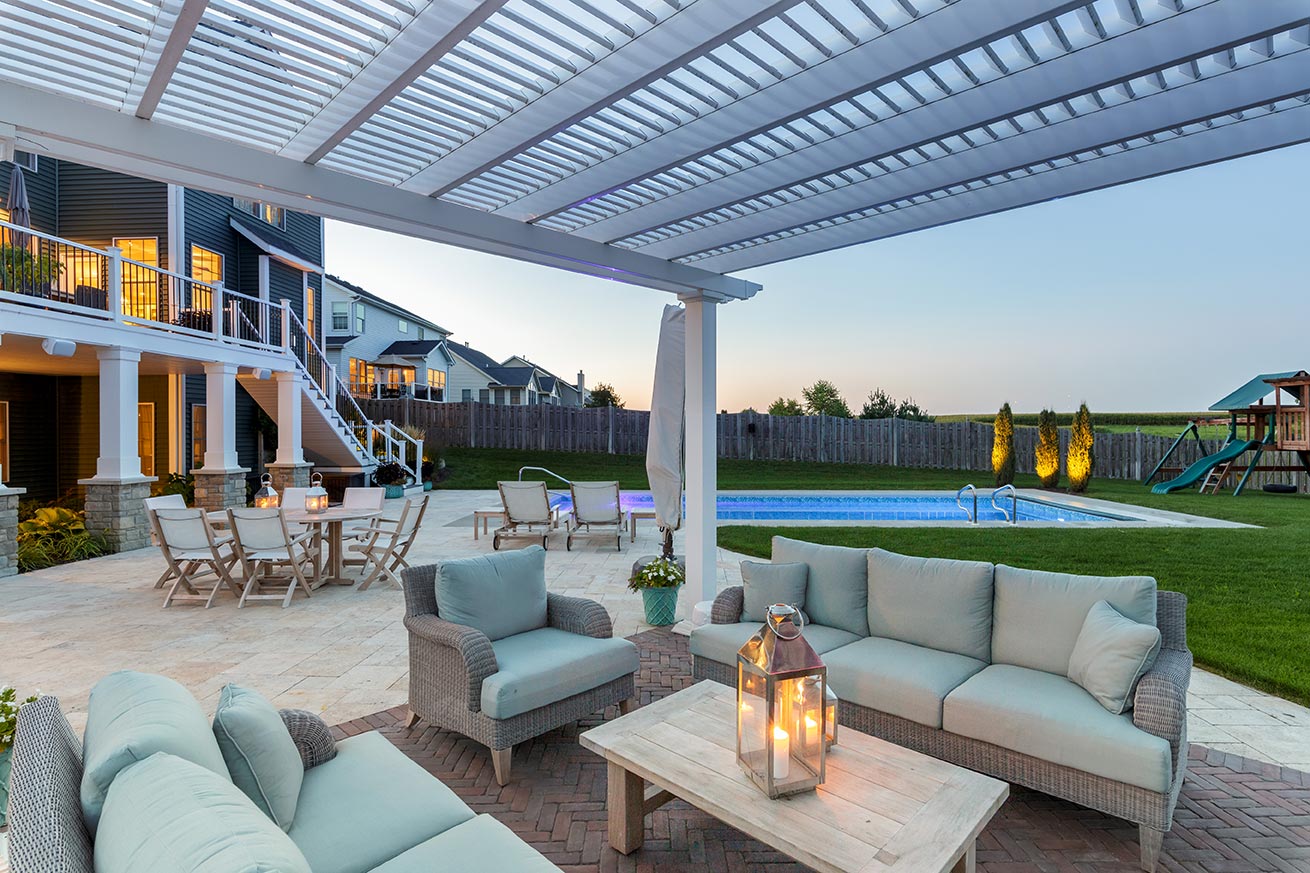 White Pergola Kit built on an outdoor patio overlooking the pool