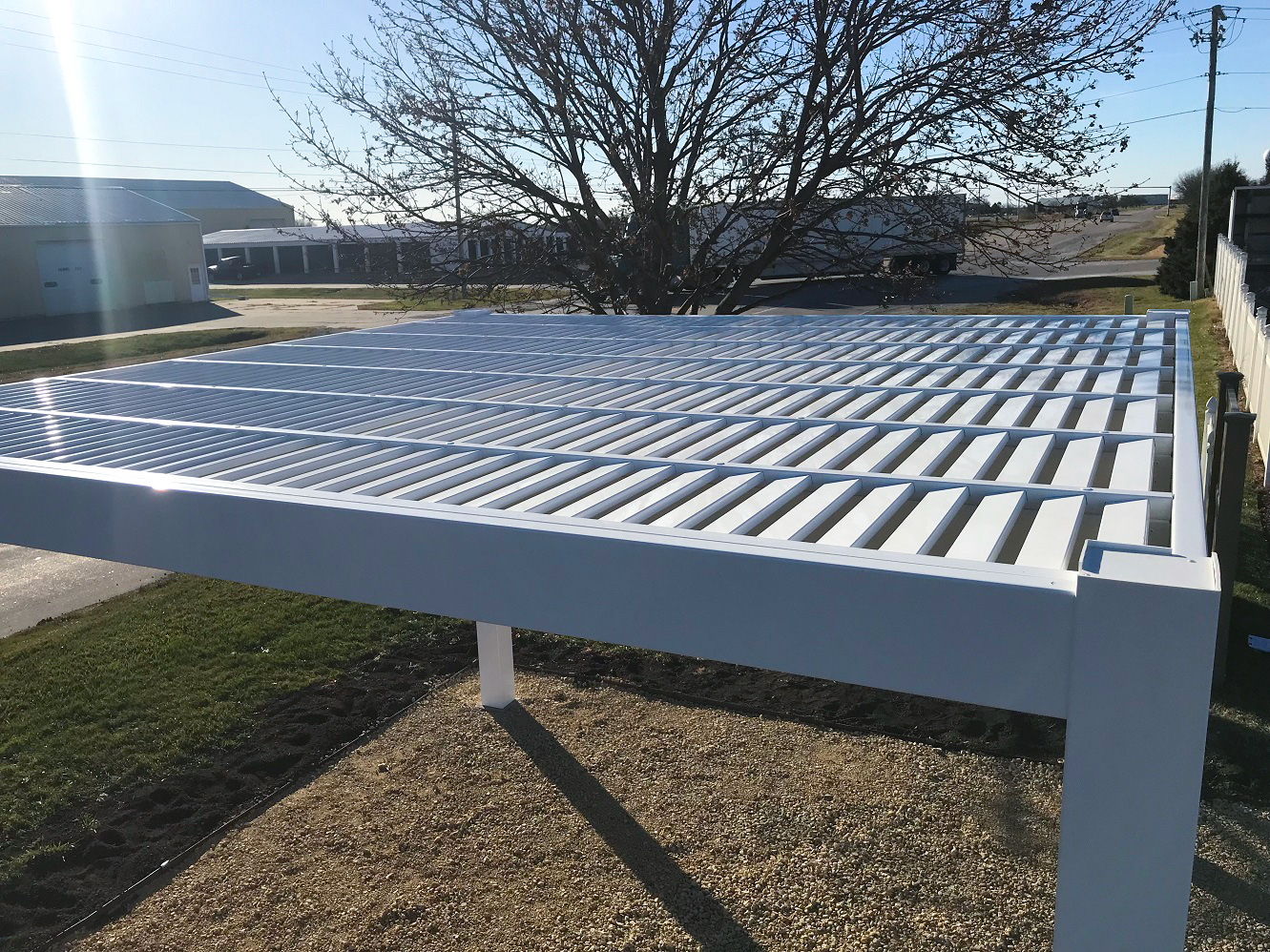 Side view of the angled purlins or louvers on a white pergola