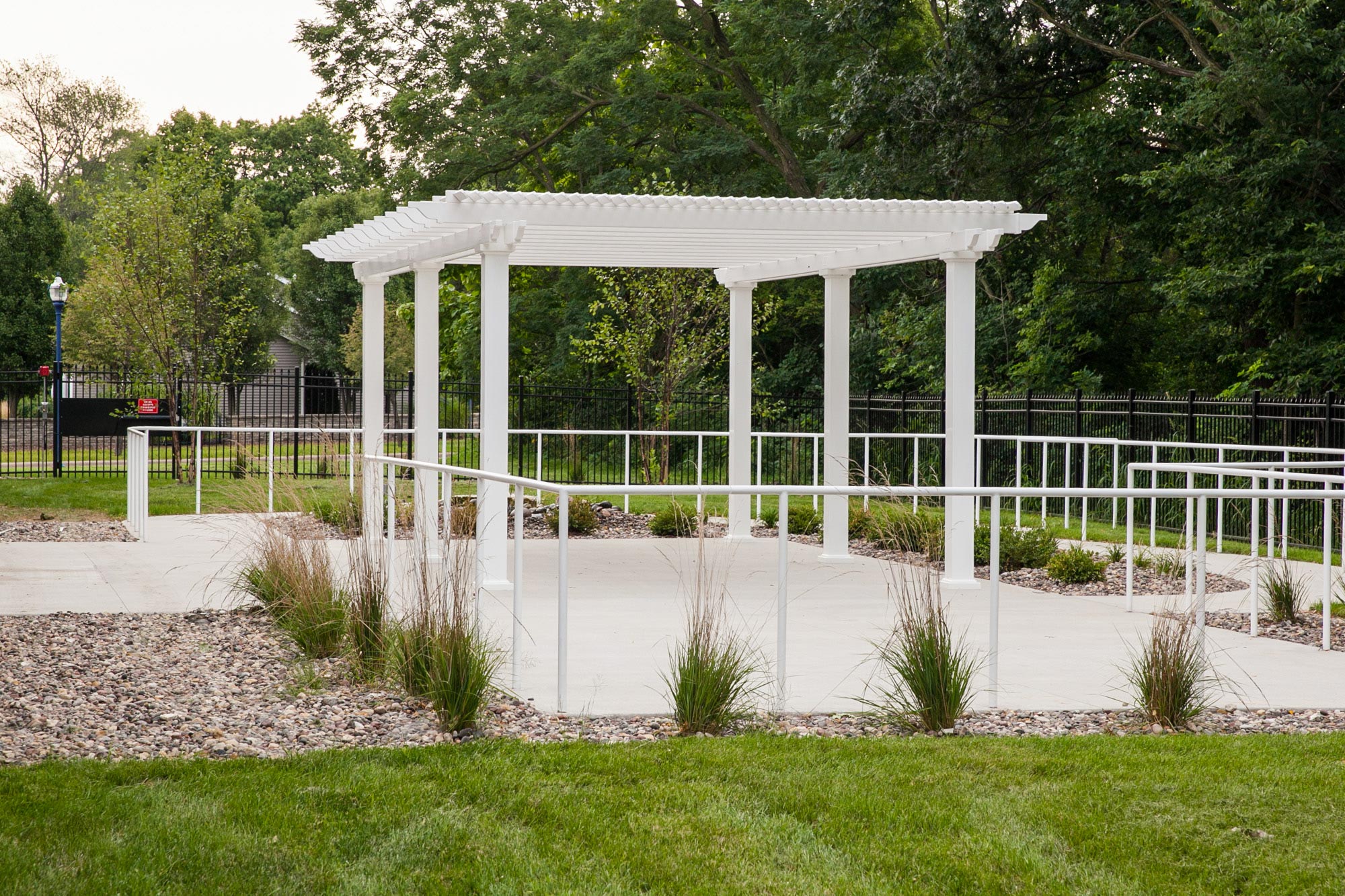 pergola in the middle of a senior living courtyard