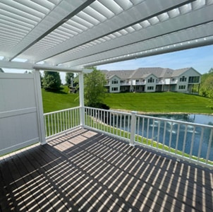 shade pattern created under a white pergola with 75% shade
