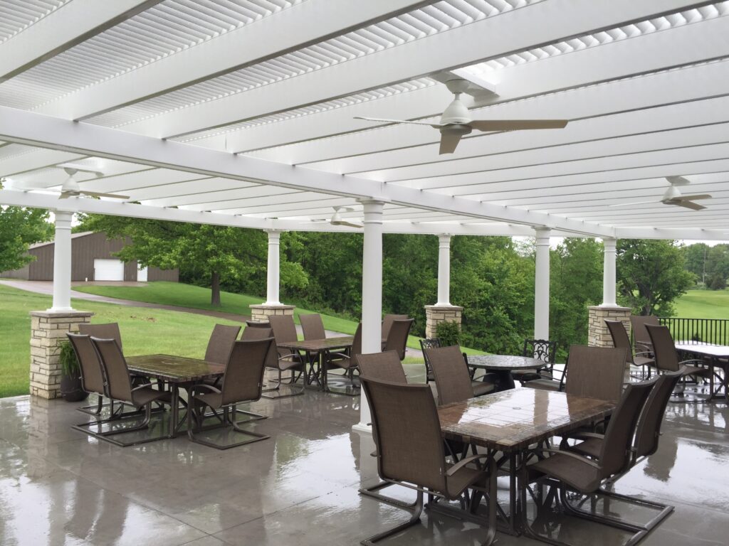 Country club patio with pergola overhead - rounded column post
