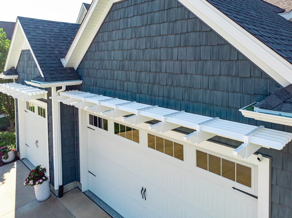 Overhead view of garage pergola on a blue house