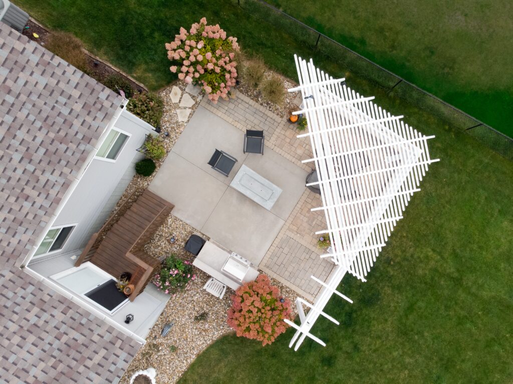 aerial view of triangle pergola with custom arbor over patio