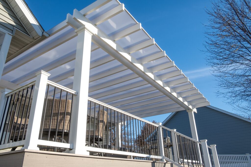 Deck with overhead covered pergola with white polycarbonate roof
