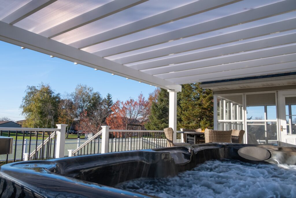 Deck with overhead covered pergola with white polycarbonate roof