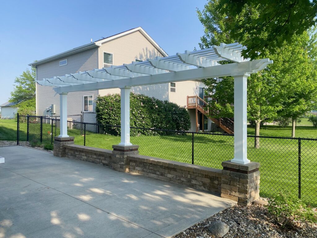 custom arbor over landscape wall