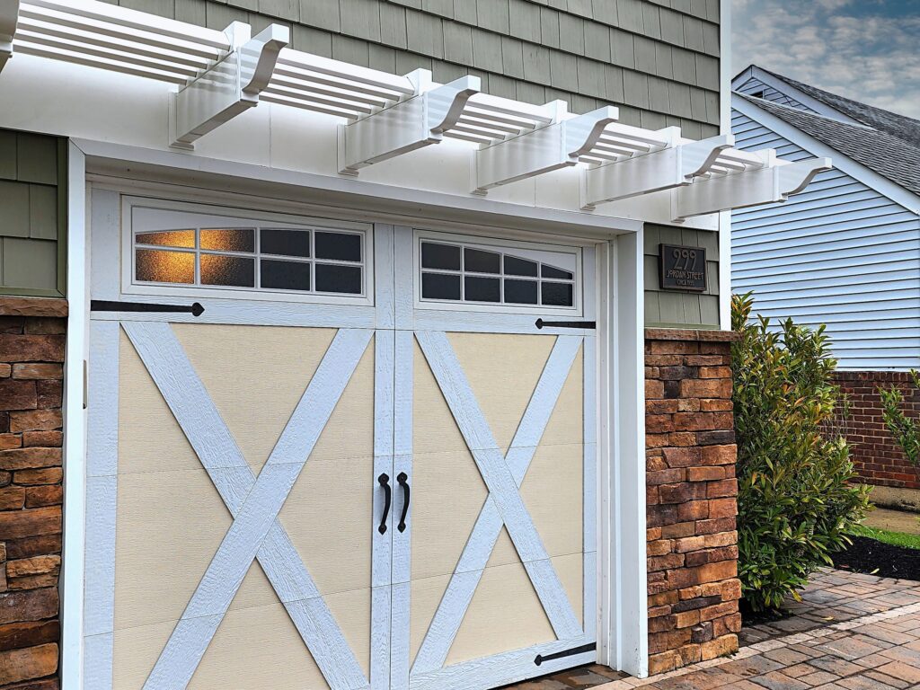 single garage door with white vinyl pergola