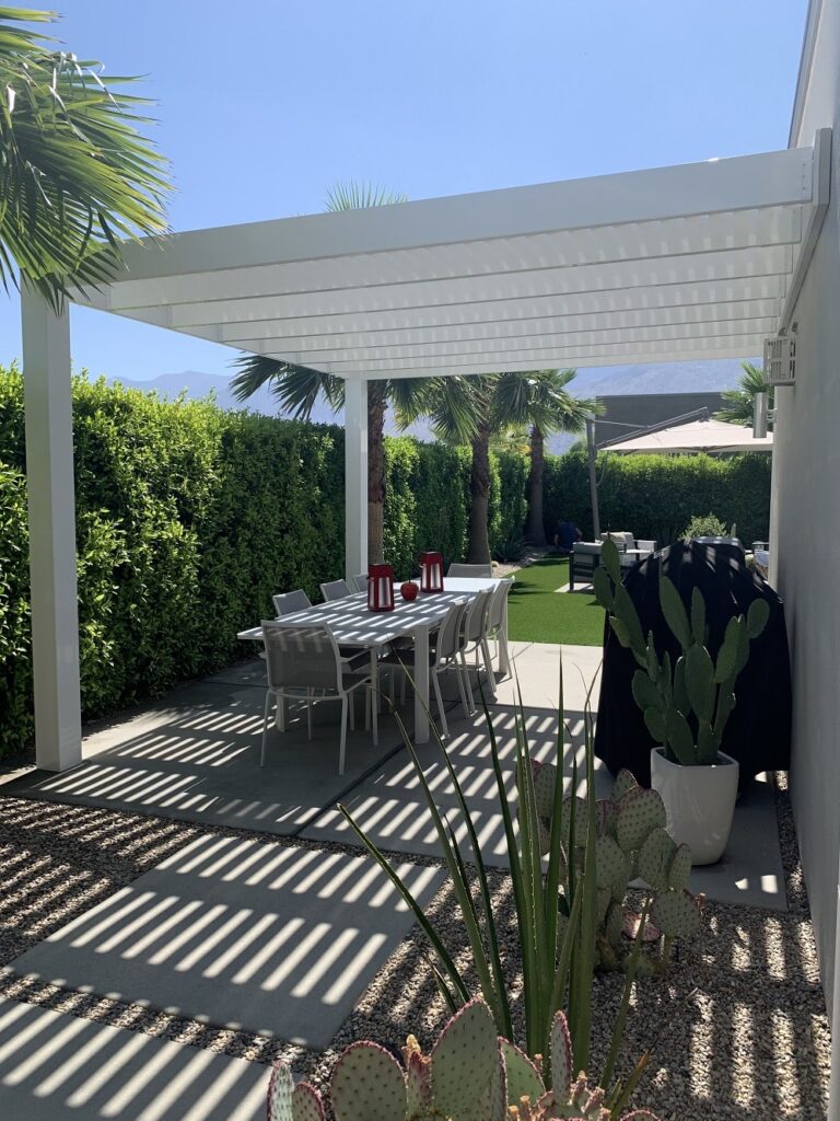 modern vinyl pergola over an outdoor dining area