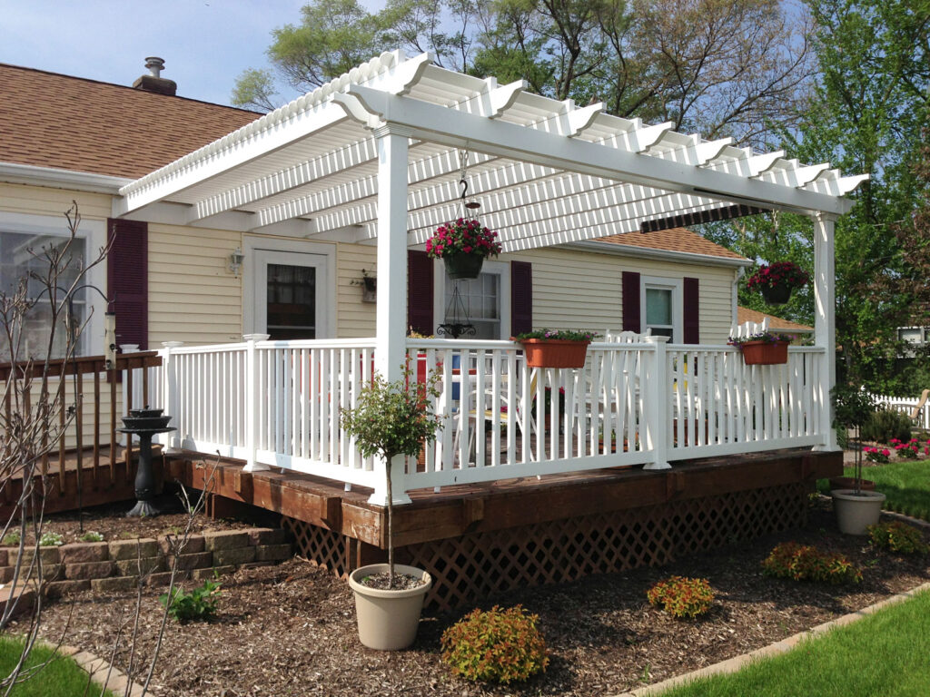 Attached deck pergola with white railings