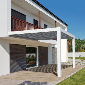 White modern pergola attached to a home over a patio area.