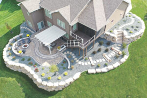 Aerial view of a highly landscaped backyard with stone retaining walls and an attached pergola over a part of the patio.