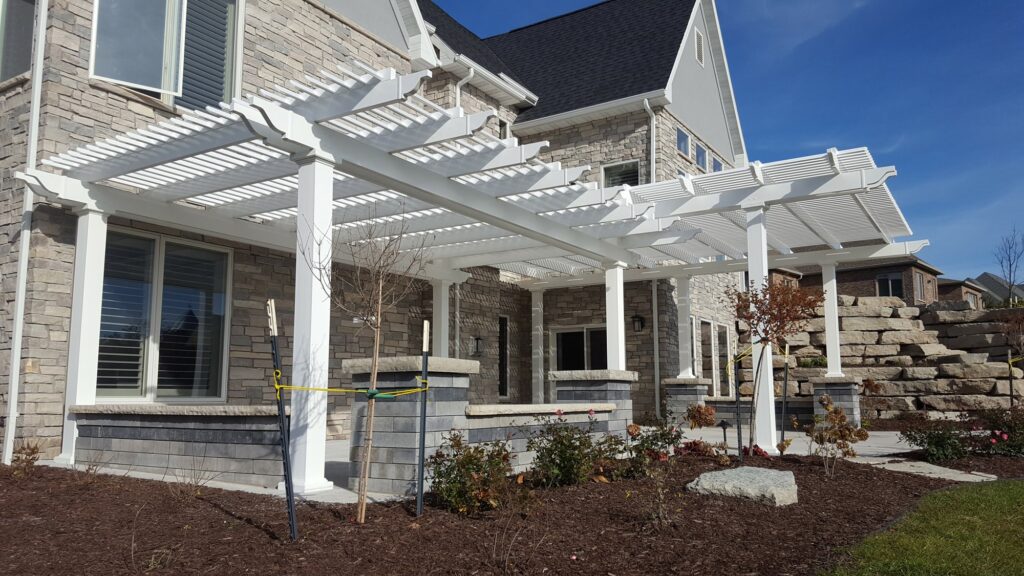 two tier L shaped pergola over large patio