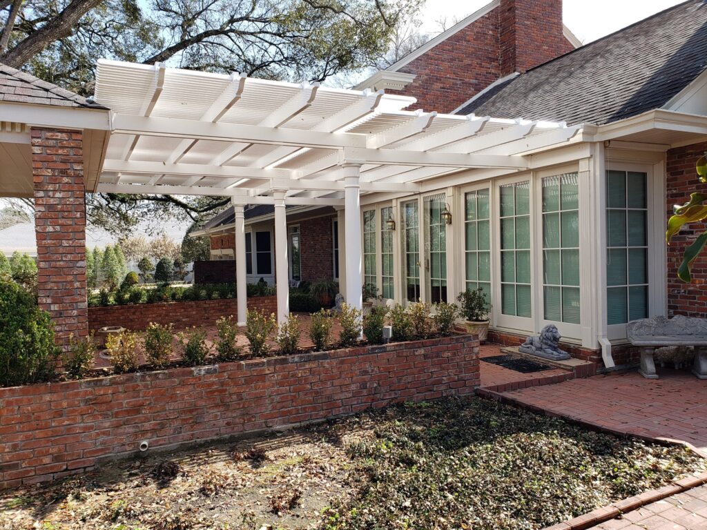 Custom two tier attached pergola in a courtyard
