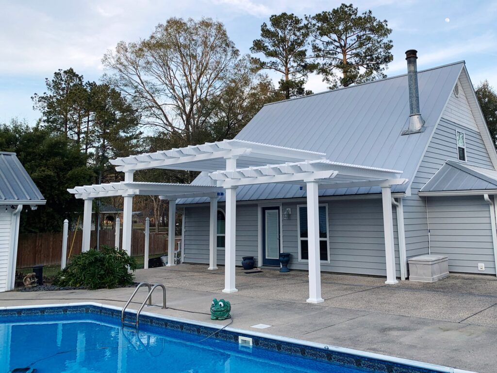 Three tier pergola next to a inground pool.