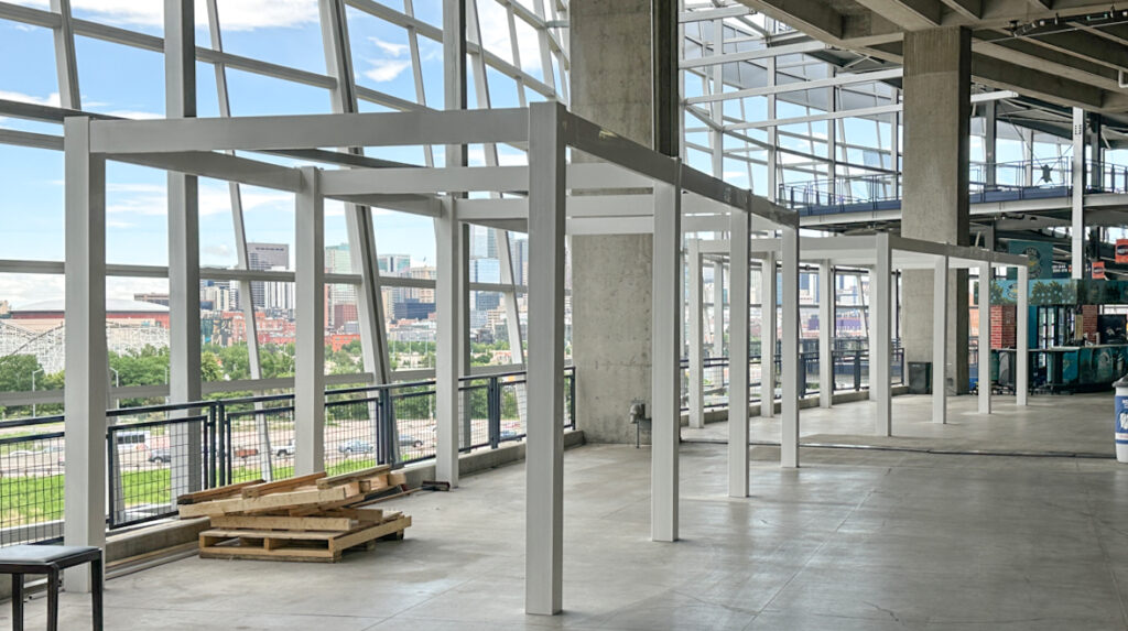 Modern Pergola framework used for Denver Broncos vendor station renovations - Vinyl over aluminum posts and beams