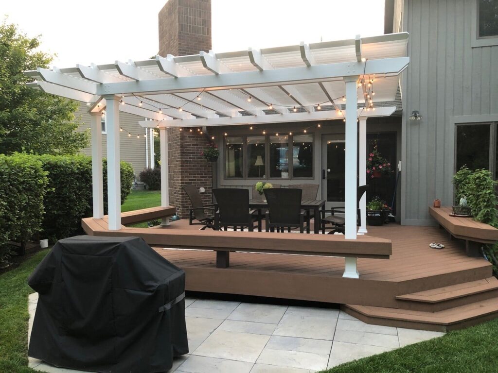 Custom white deck over a backyard deck