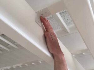 holding up a hurricane clip up under the pergola rafter